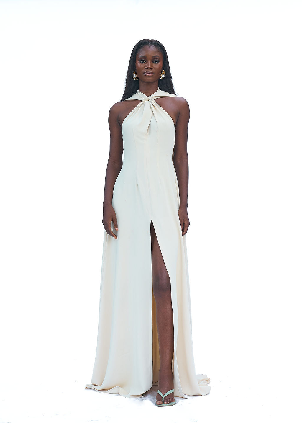 Cream halter evening gown with high slit and long train