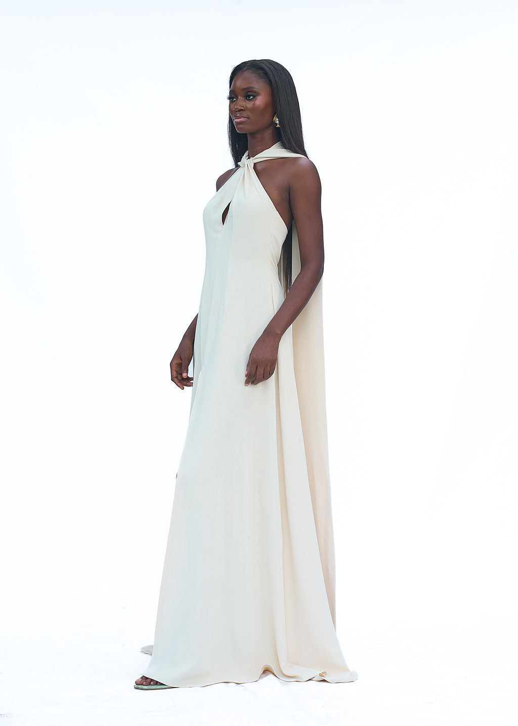 Cream halter evening gown with high slit and long train