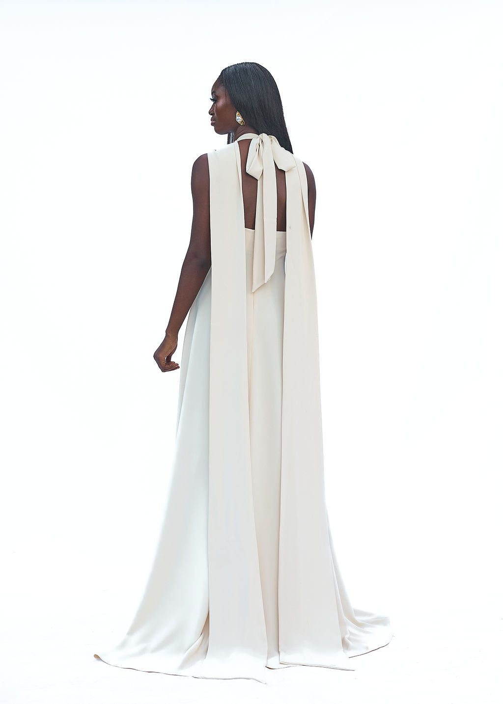 Cream halter evening gown with high slit and long train